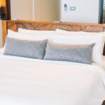 Beautiful luxury white pillow on bed decoration in bedroom interior - Vintage Light Filter